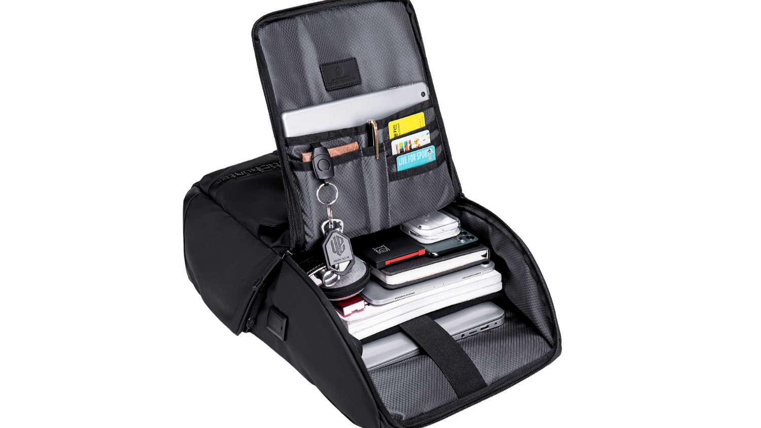 Jet Black Rucksack geöffnet – befüllt und organisiert mit Laptop, Tablet und Zubehör